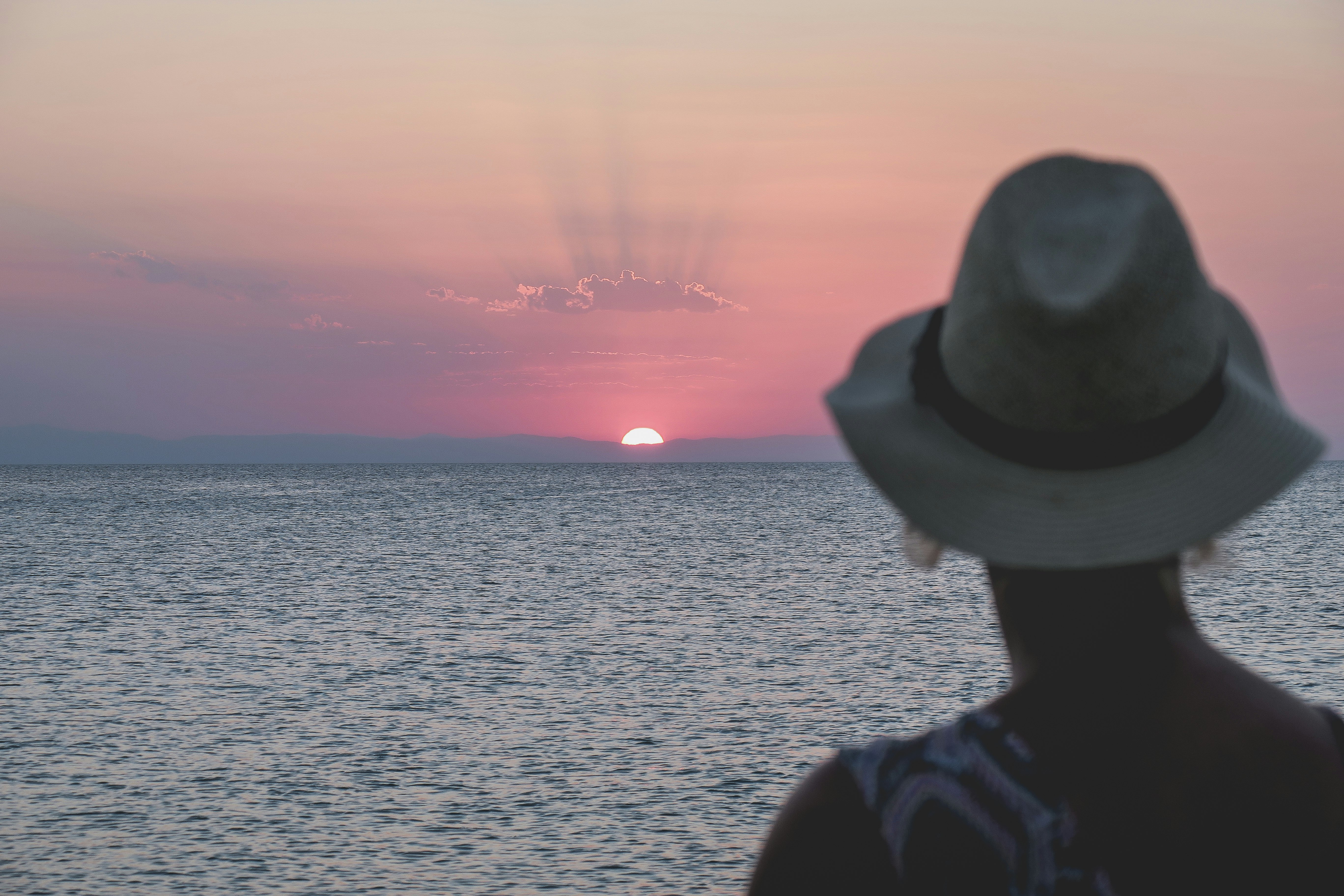 woman facing sunset