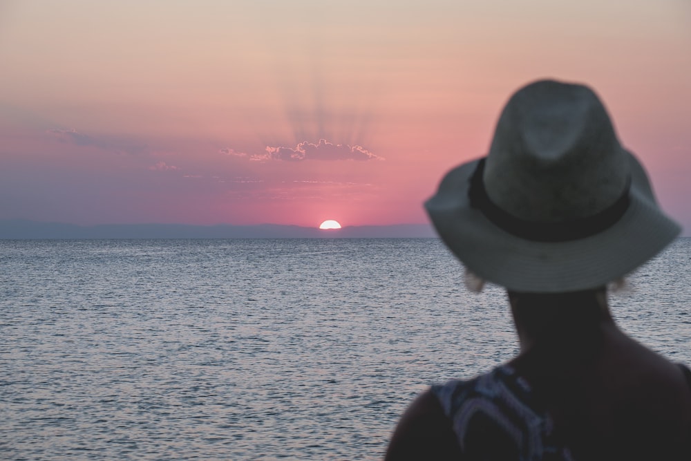 woman facing sunset