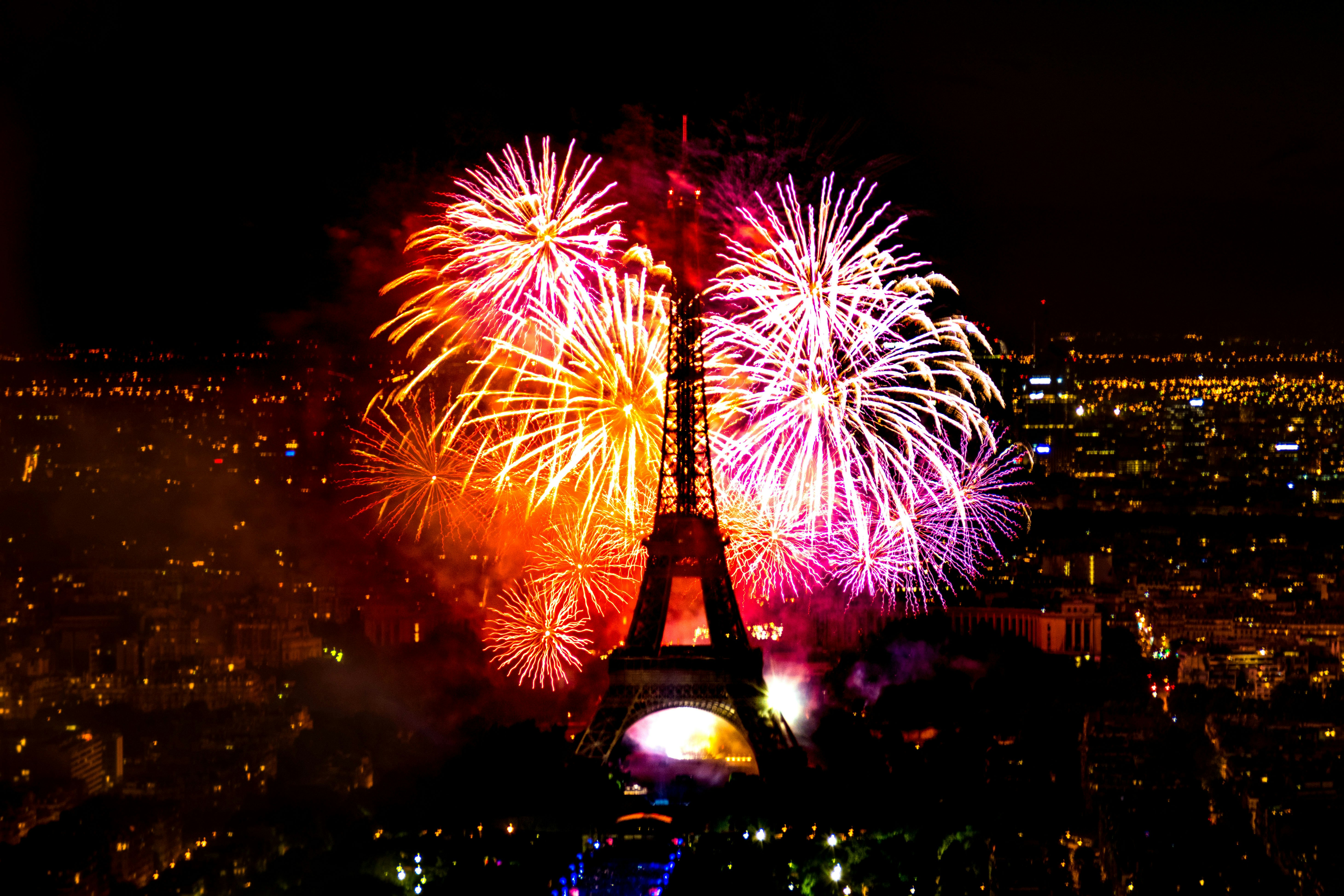 A fireworks display behind the Eiffel Tower in France.