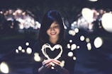 A woman holding a heart