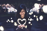 A woman holding a heart