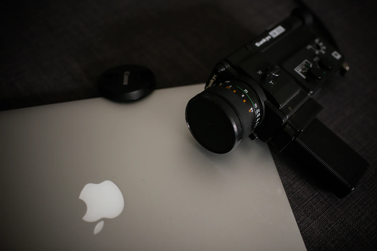 Camera sitting on top of a laptop