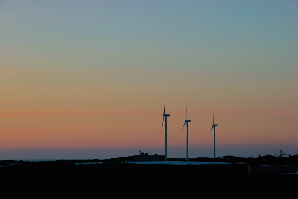 silhouette of wind turbines