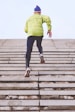 person climbing concrete stairs