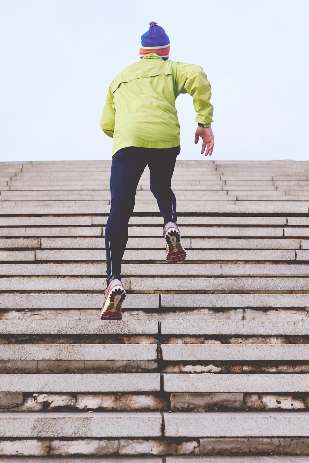 person climbing concrete stairs