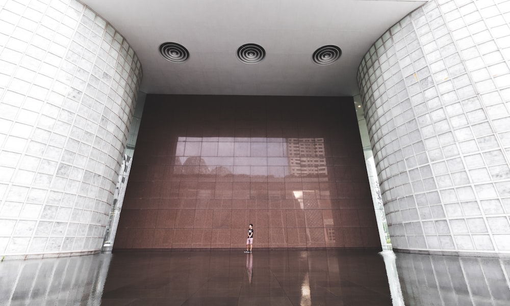 man standing inside building