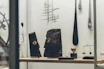 Collection of unique 3D printed art pieces displayed on a wooden shelf