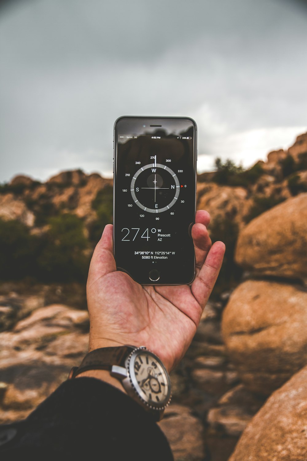 selective focus photography of person holding space gray iPhone 6