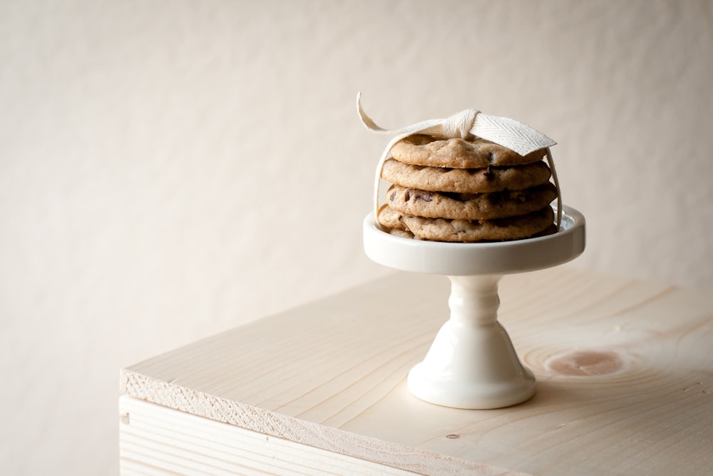 cookies on white footed saucer