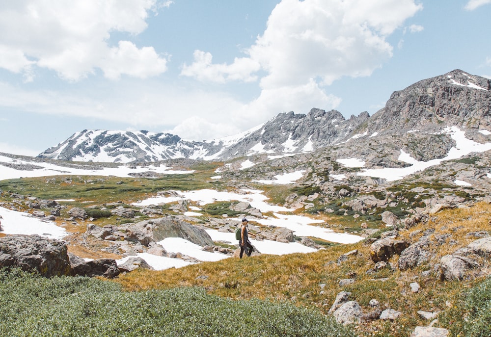 person walking near mountain