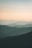 mountains under white mist at daytime