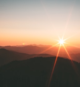 silhoutte of mountains during sunset