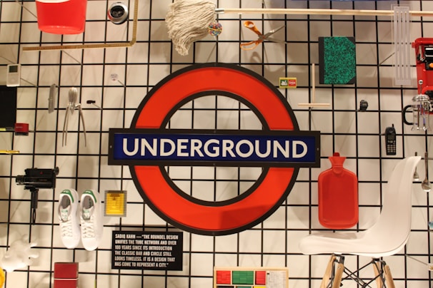 A collection of everyday objects arranged carefully in a corner, showing the human side of sewer life.