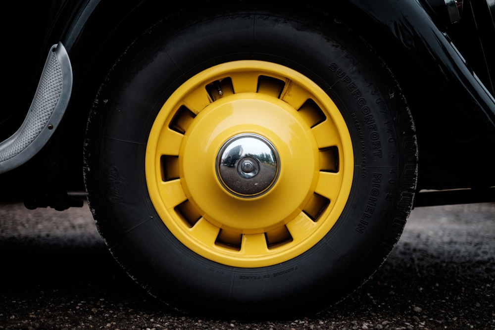 yellow vehicle wheel with tire