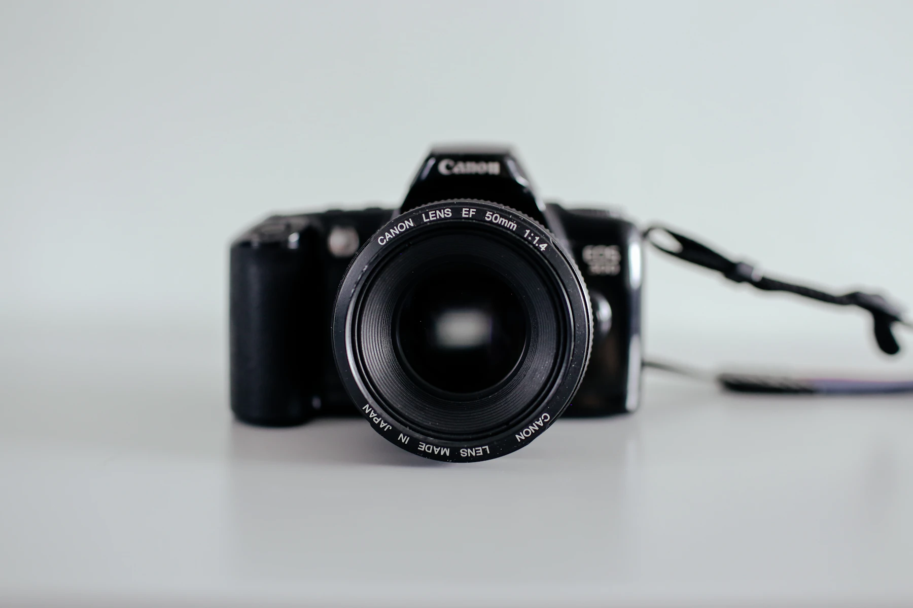 Camera on a dark creative set with cinematic low-light atmosphere