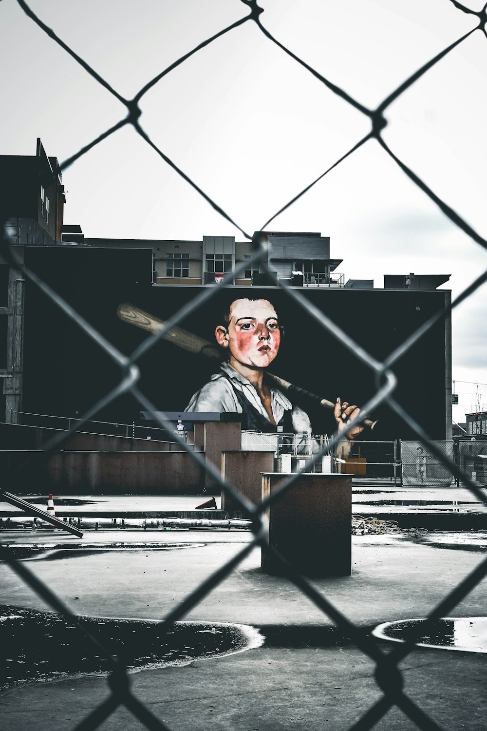 selective color photography of man holding baseball bat wall art