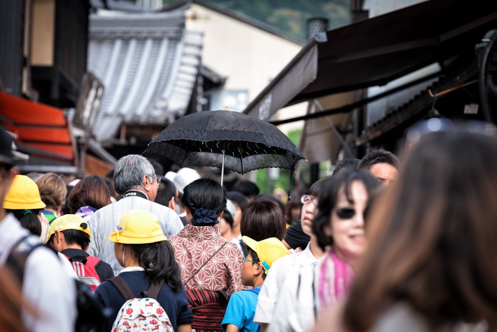 Red Yellow Black And White Kimono And Holding Black Mask Photo Free Image On Unsplash