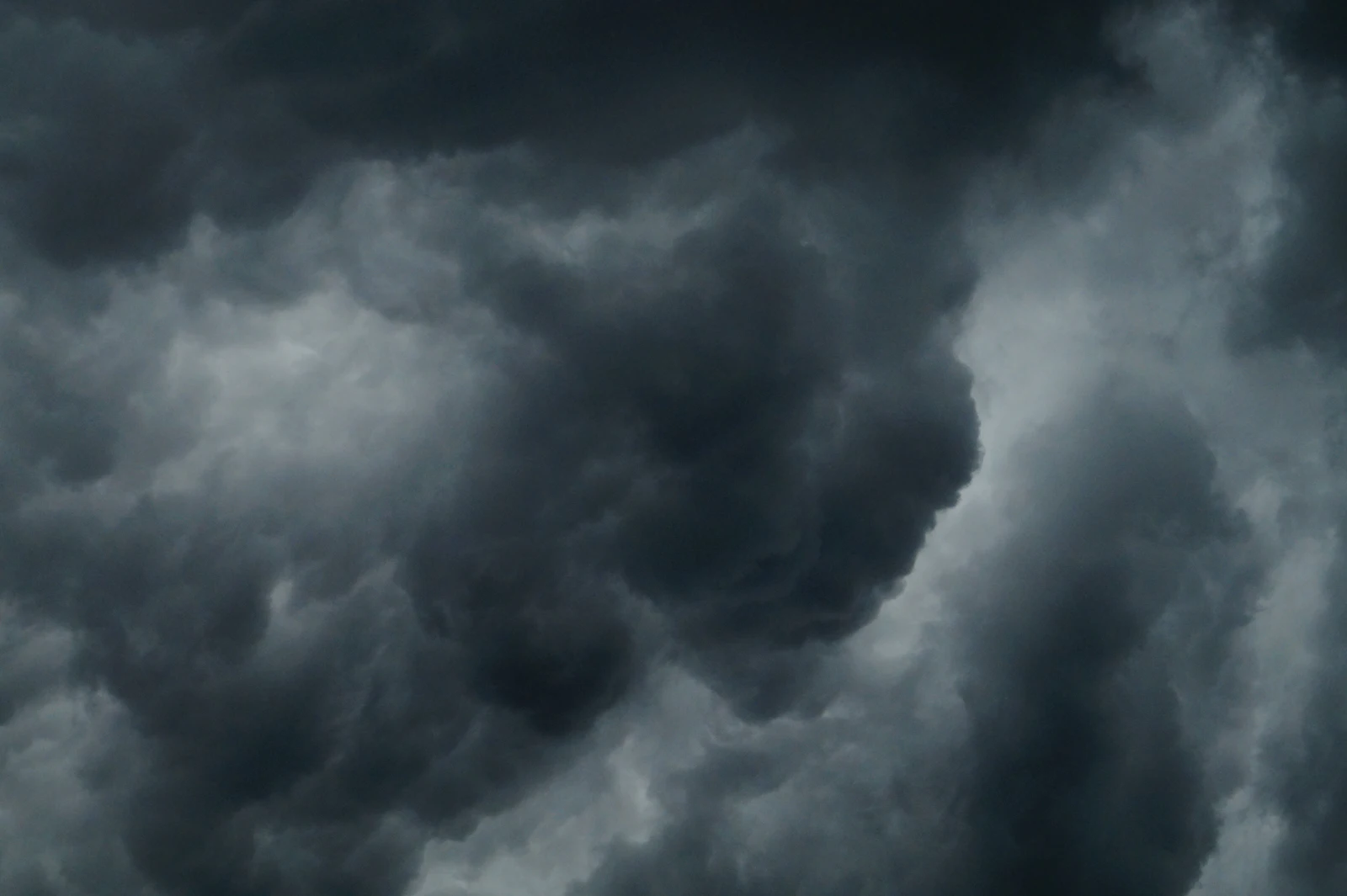 Clouds rolling over a coastal landscape