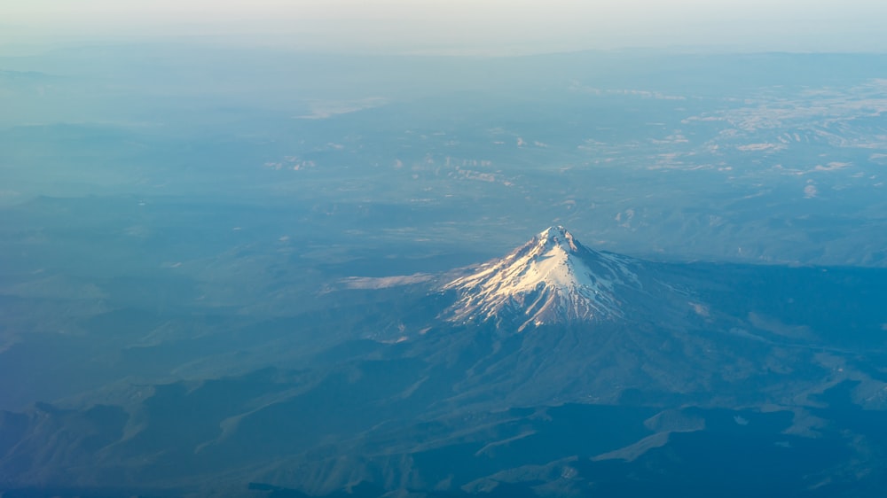 mountain covered with fog during daytime