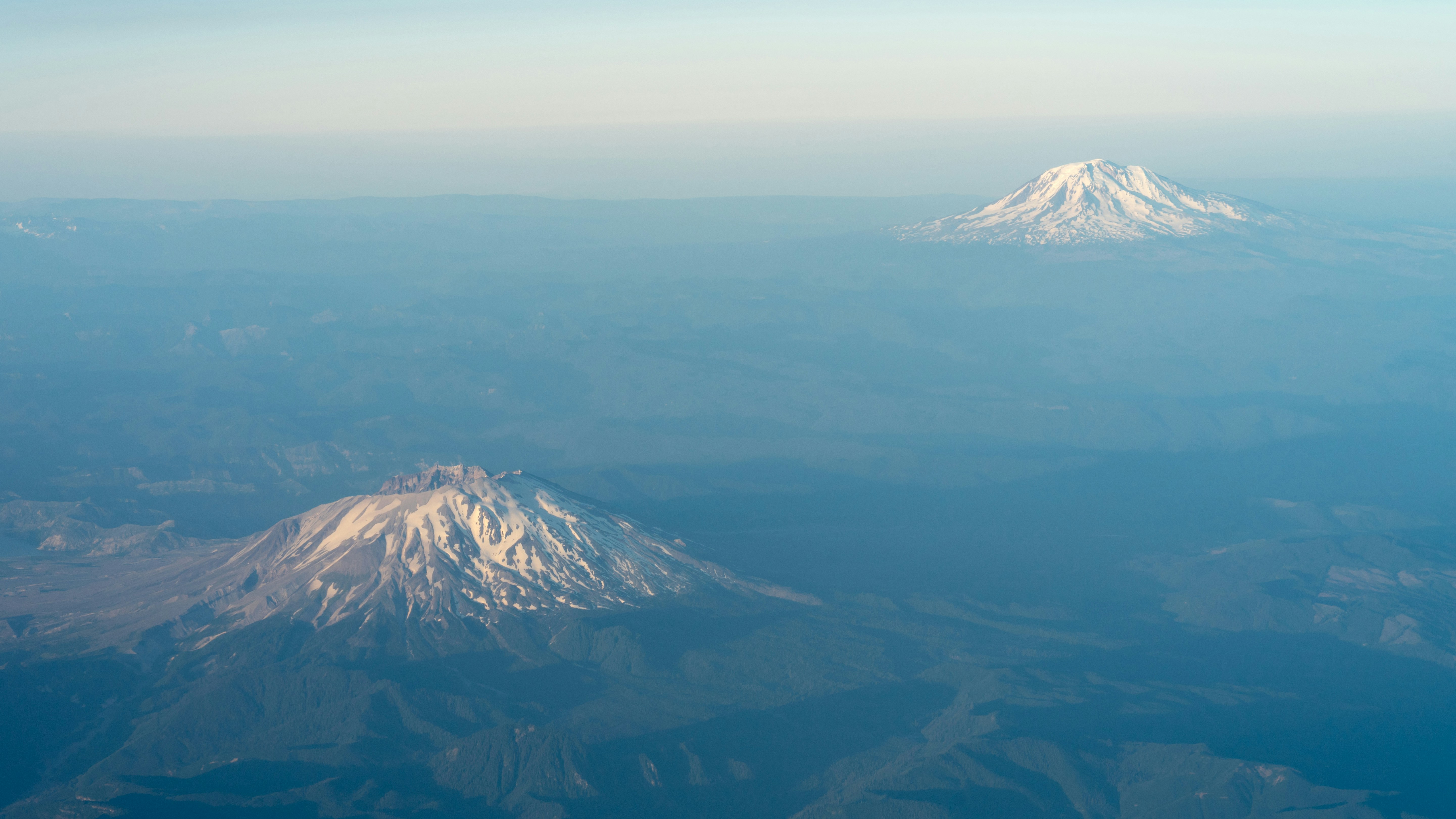two snowy mountains, window seat on the way back home