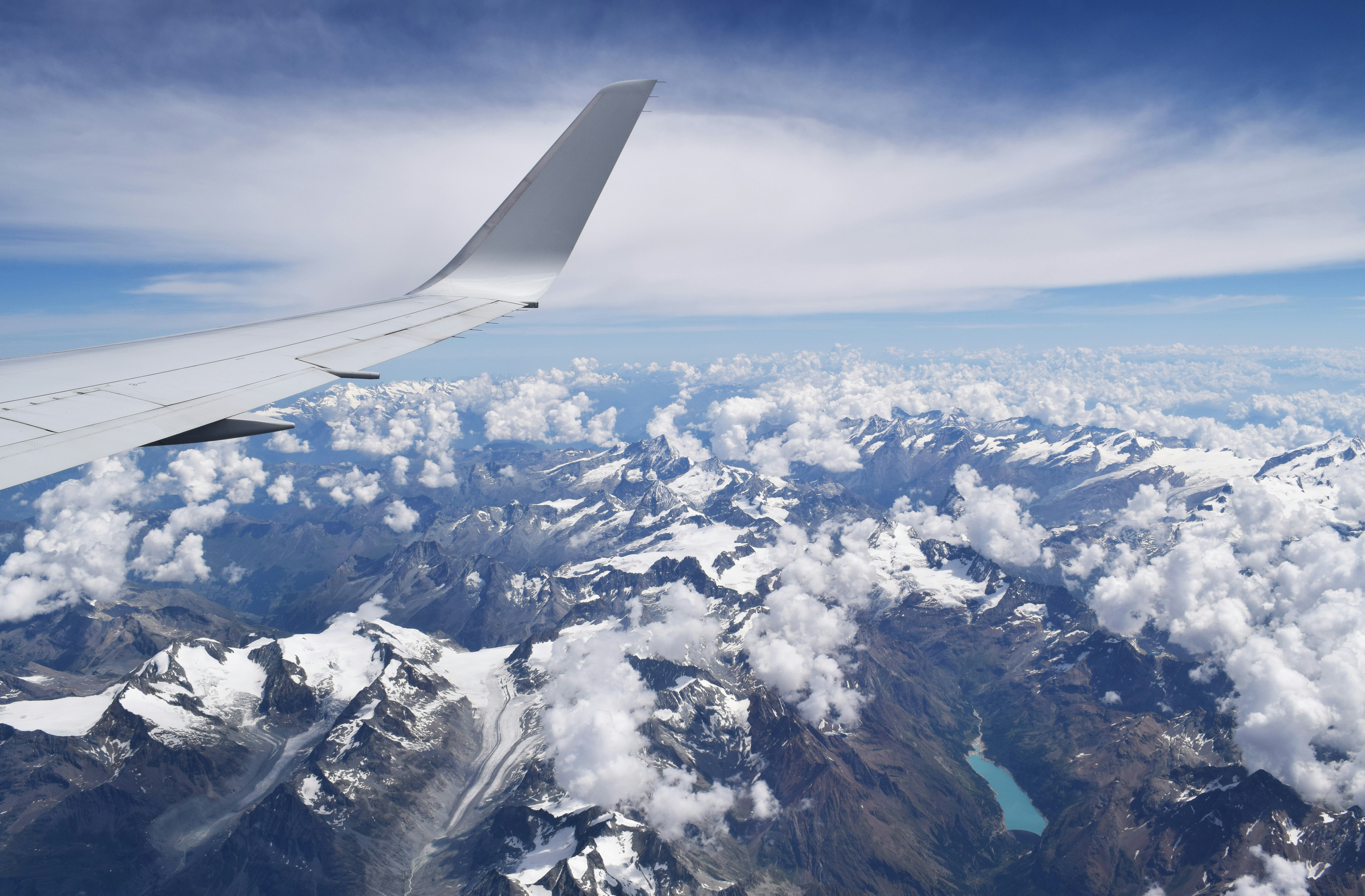Plane wing over clouds
