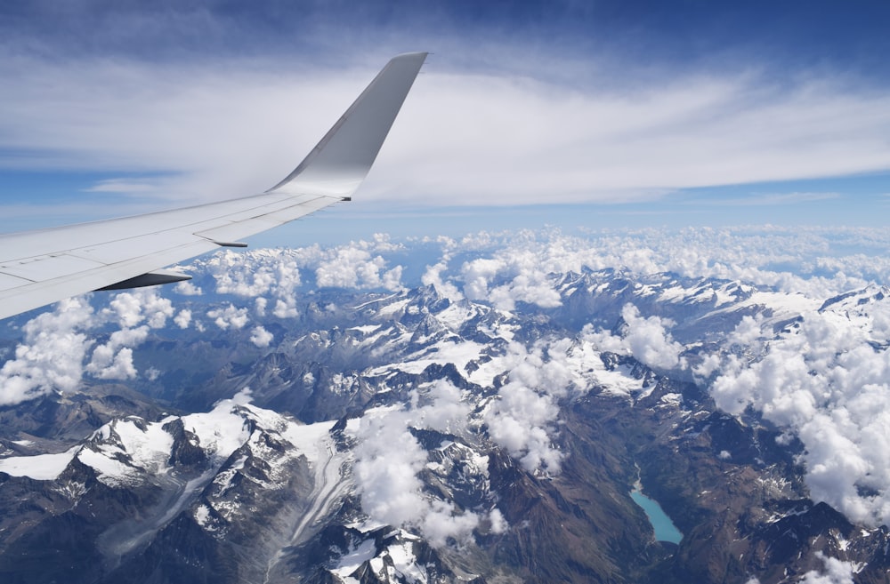 snow covered mountain airplane window view