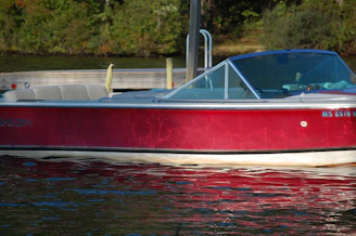 A gleaming boat docked by the water after a thorough detailing session.