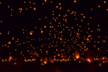 A serene moment capturing the glow of lanterns illuminating a nighttime celebration centered on the mandar drum.