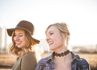 two woman taking a sideview selfie