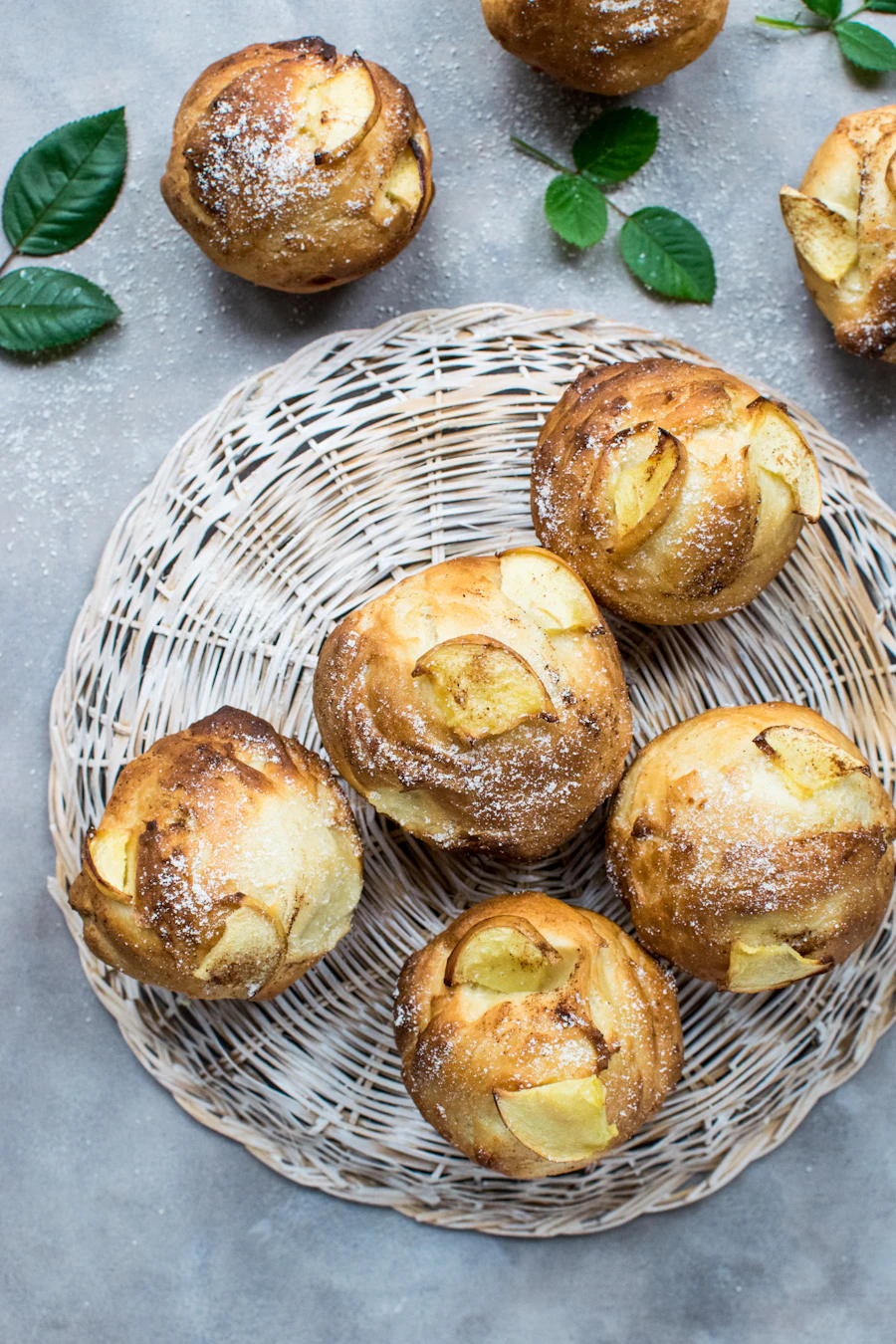 Sugar-dusted buns in a woven basket