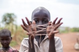 boy showing hand with rubber