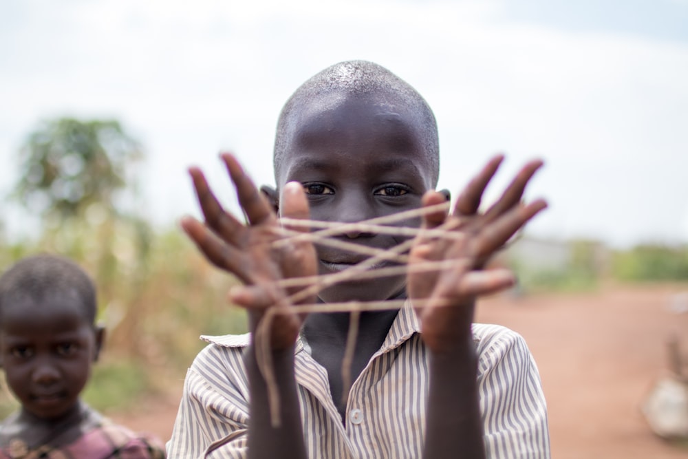 boy showing hand with rubber