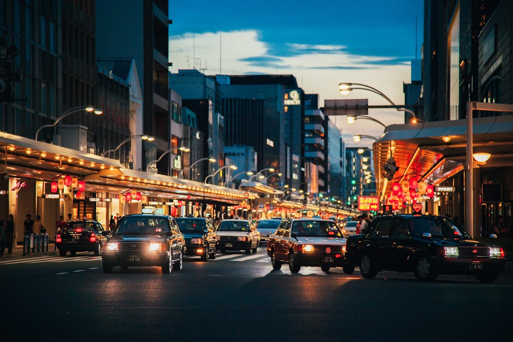 cars on gray asphalt road in the city during nighttime