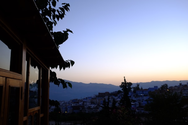 A serene landscape photograph blending urban and natural elements at dusk, symbolizing cultural intersections.