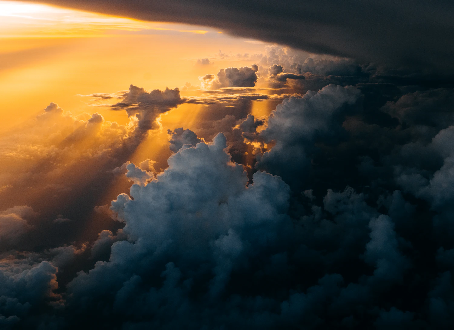When clouds race across the sun the light shifts by stops within seconds, which is when aperture priority with exposure compensation keeps up better than manual.