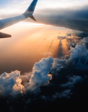 airplane on sky during golden hour