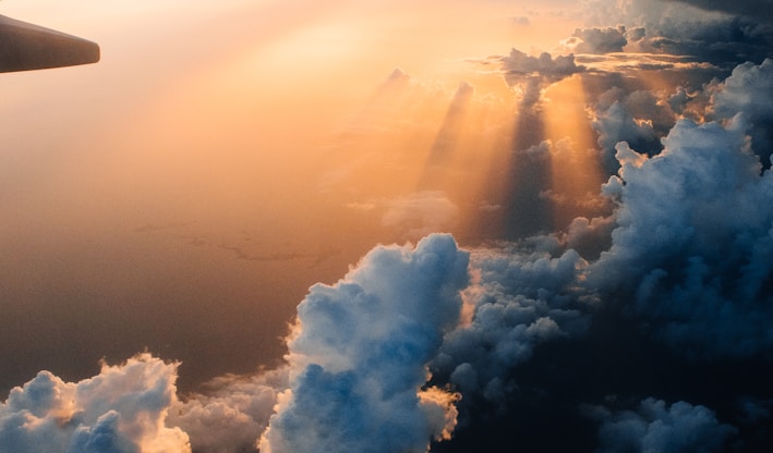 airplane on sky during golden hour