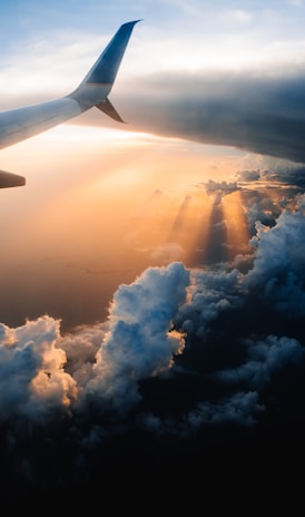 airplane on sky during golden hour