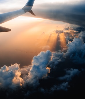 airplane on sky during golden hour