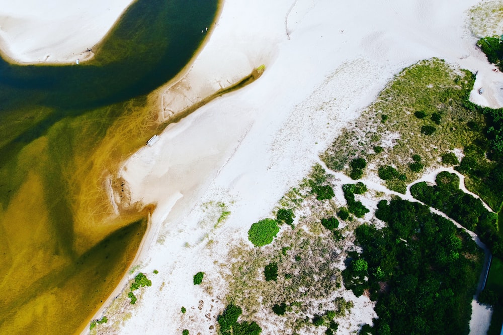 an aerial view of a body of water and land