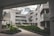 A modern residential complex featuring curved architecture with multiple stories. The buildings are white, with glass balustrades on the balconies. The setting includes landscaped green areas with well-maintained shrubs and small trees. The sky is partially cloudy, creating a serene and tranquil environment.