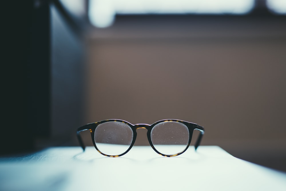 shallow focus photography of eyeglasses