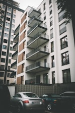 cars parked beside building