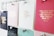 A collection of motivational quotes displayed on different colored cards pinned to a board. Each card has gold lettering featuring different inspirational sayings. The board is organized with silver pins holding the cards in place.