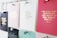 A collection of motivational quotes displayed on different colored cards pinned to a board. Each card has gold lettering featuring different inspirational sayings. The board is organized with silver pins holding the cards in place.