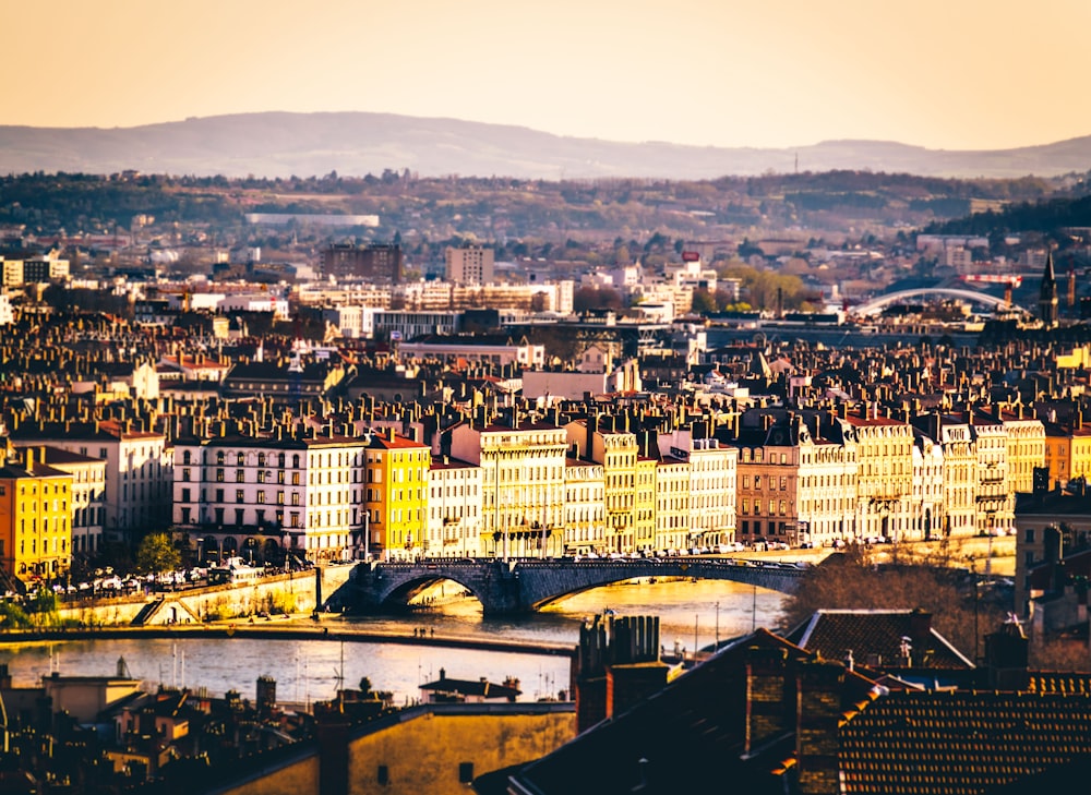 A large cityscape with mountains in the horizon.