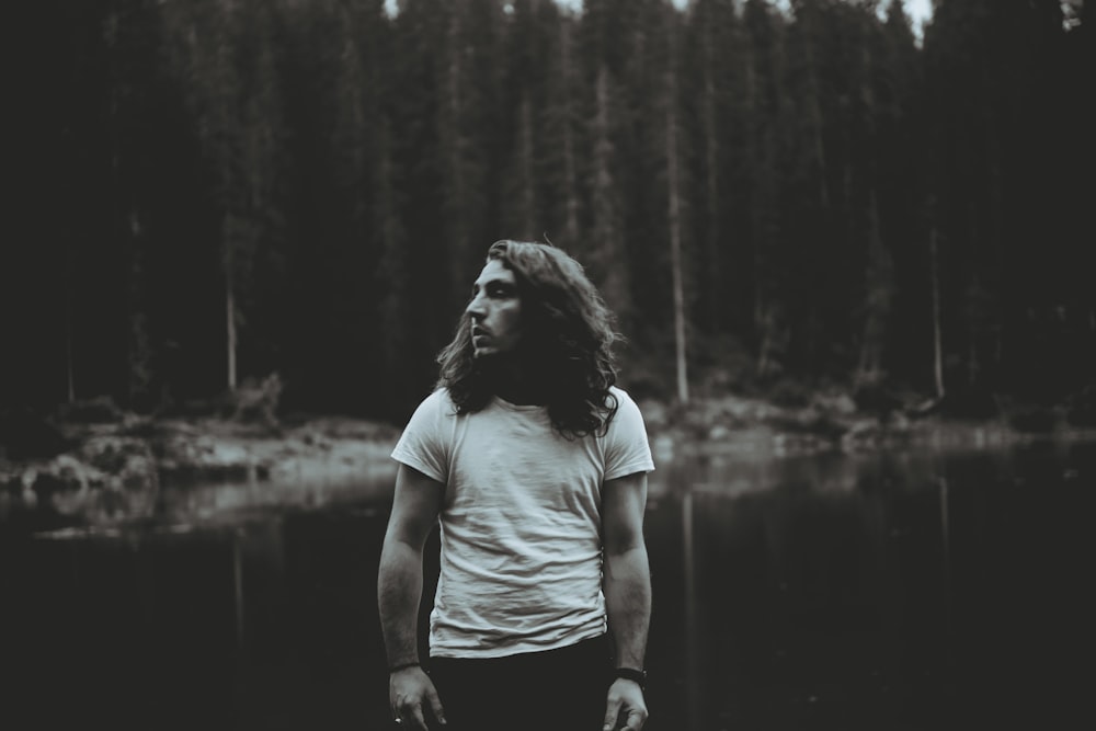 man standing near body of water