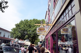 A vibrant local business storefront with people walking by.