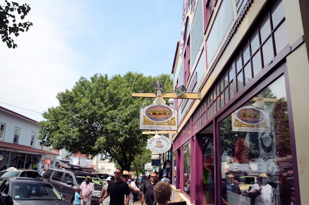 A vibrant local business storefront with people walking by.