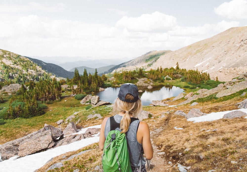 Woman looking out at a mountain landscape on a scenic hike